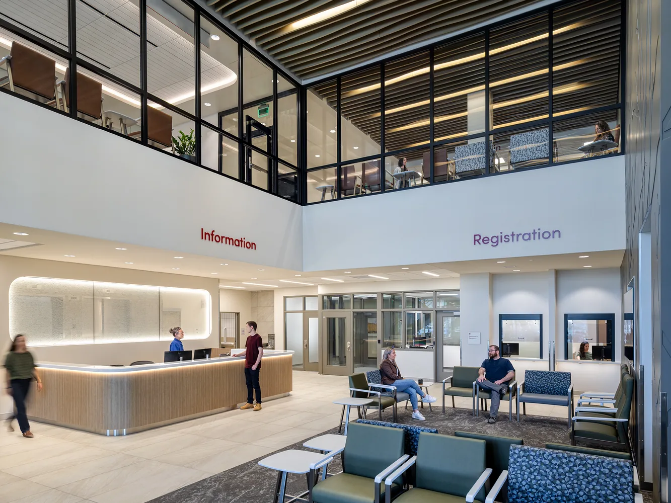 Double-height crisis centre lobby with information and registration desks