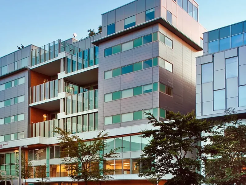 Exterior of the multi-storey health centre with coloured cladding panels